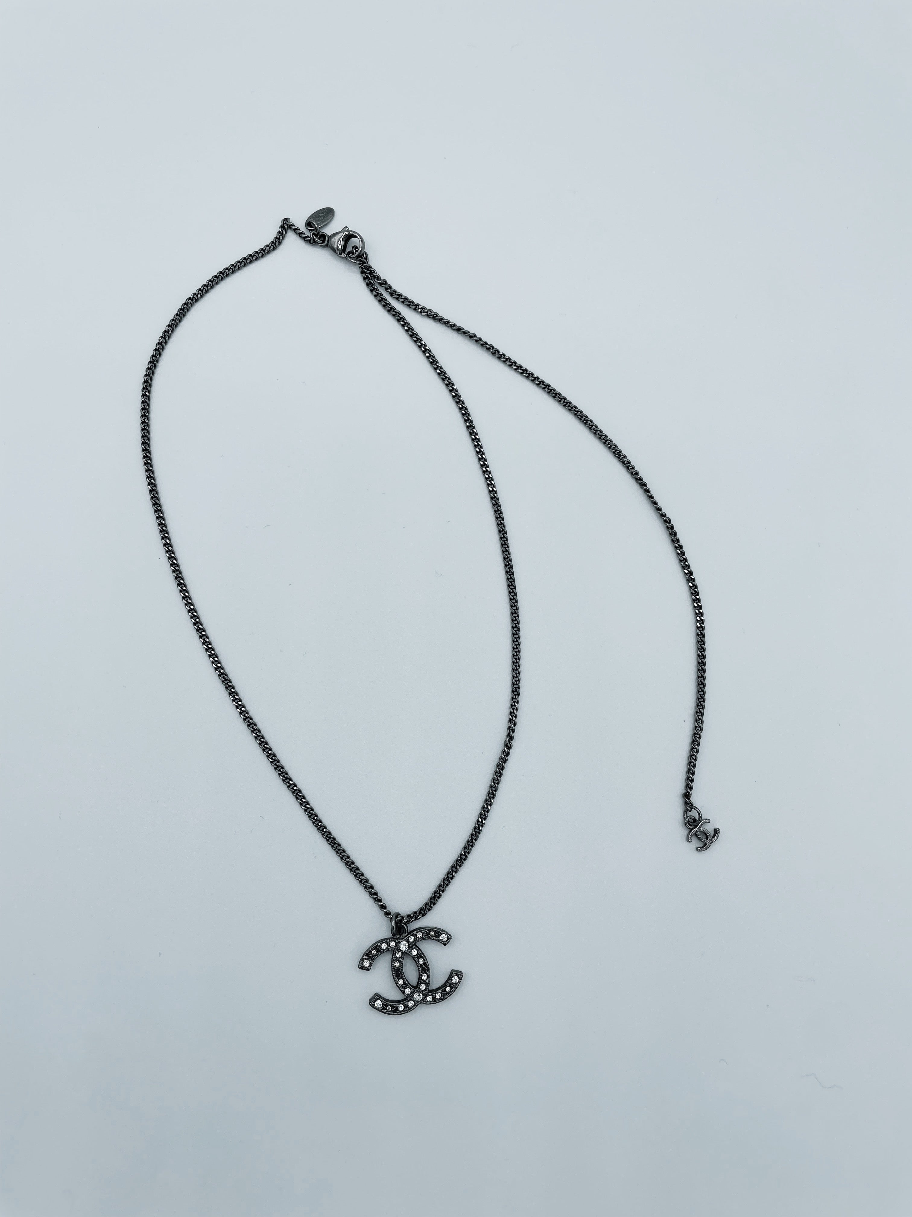 Vintage Chanel Small CC Gunmetal Black and Crystal Embellished Necklac –  The Tiny Dinostore