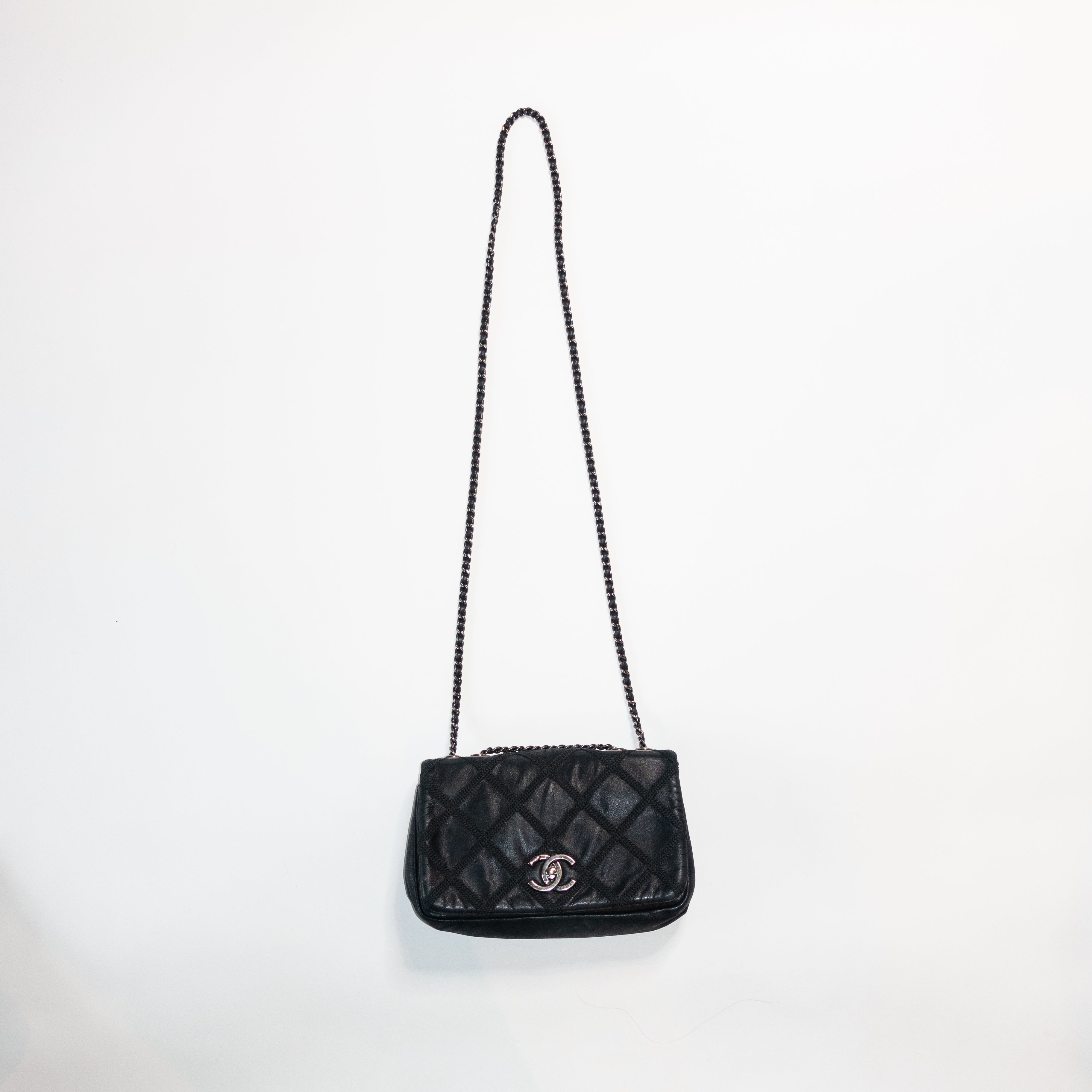 white chanel bag with black logo purse